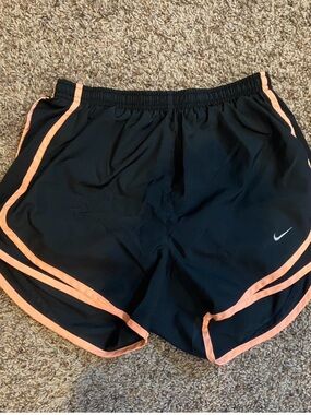 Nike Women’s Black Athletic Shorts with Coral Trim